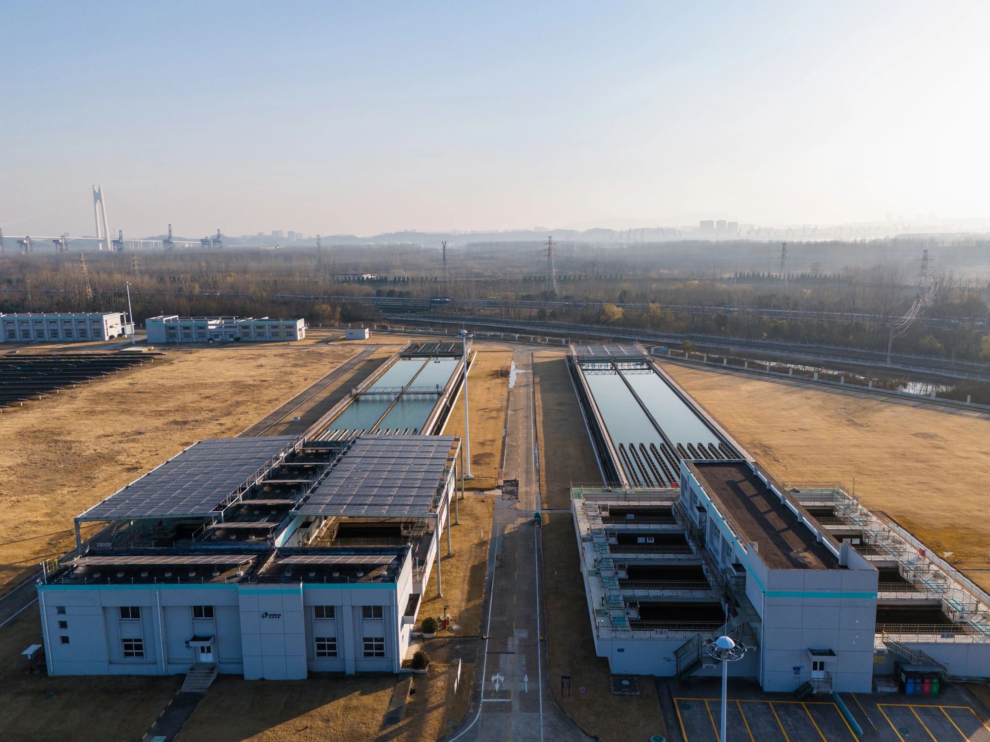 An aerial view of solar panels on a grassy field.